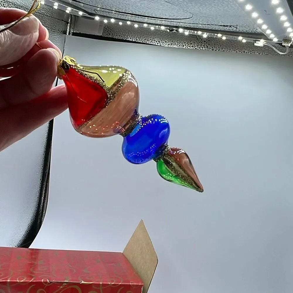 Vintage Avon 2001 Holiday Treasures blown glass ornaments.